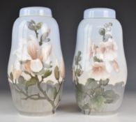Royal Copenhagen pair of covered shaped vases decorated with magnolia and hollyhocks, height 31cm