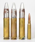 Three Bofor or similar inert shells together with a smaller inert brass example