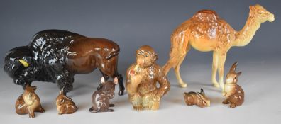 Beswick novelty monkey smoking a pipe, bison, rabbits including one with red label, mouse etc