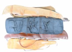 Six various shotgun slips including canvas and leather examples.