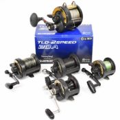 Five Shimano multiplier fishing reels comprising two TLD 5, two TLD 15 and a boxed TLD two speed