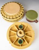 Italian inert antitank mine together with the top piece of a similar mine and a Russian