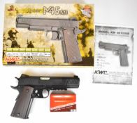 KWC M45 A1 .177 CO2 air pistol with chequered grips and 21 shot magazine, serial number 48016185, in