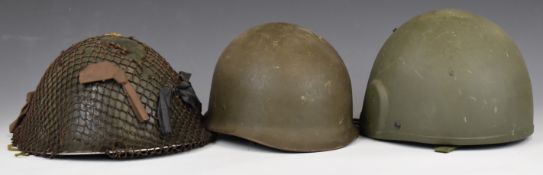 Three combat helmets comprising GSMK6 dated 1988, 'turtle' with scrim net and an American example,