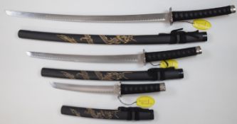 Graduated set of three modern Japanese swords by 'Ancient Warrior', all with scabbard, longest blade