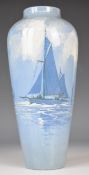 A 19thC pottery vase decorated with a sailing ship and figures, signed R Dean, possibly Derby /