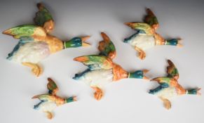 Beswick set of five flying mallard wall plaques / pockets 596-0 to 4, tallest 30cm
