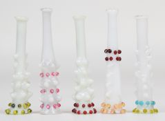 Five opalescent glass cheroot holders with ribbed and applied decoration, 5.5cm long.
