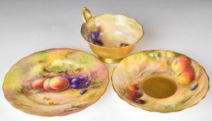 Royal Worcester painted fruit trio, the cup and side plate signed Lockyer, the saucer signed