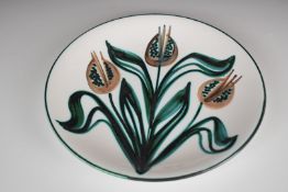 Robert Picault studio pottery charger with enamelled tulip decoration signed with monogramme