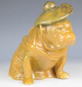 Royal Doulton figure of a Bulldog in khaki colour, with tam o'shanter hat, height 18cm