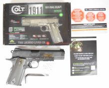 Colt 1911 Rail Gun Series 6mm CO2 air pistol with chequered grips and 17 shot magazine, serial