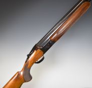 Miroku 12 bore over and under ejector shotgun with engraved locks, chequered semi-pistol grip and