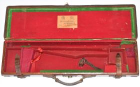 Brass and leather bound rook rifle case with label 'Holland & Holland Gun & Rifle Manufacturers 98