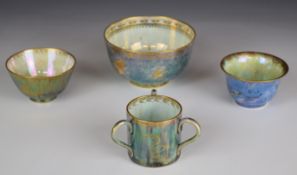 Wedgwood lustre ware tyg and three pedestal bowls decorated with snakes, exotic birds, fish etc,