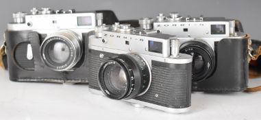 Three Zorki 4 Russian 35mm rangefinder cameras with Jupiter 2/50 lenses