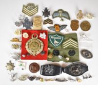 Collection of Rhodesian military ephemera including badges, rank insignia, parachute qualification
