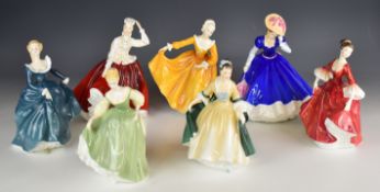 Seven Royal Doulton figurines including Mary, tallest 27cm