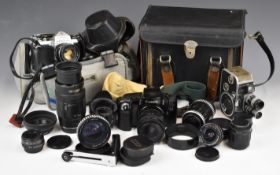 Canon EOS100 35mm SLR camera with Canon 70-210mm and 28-70mm and Sigma 1:2.8 24mm lenses, together
