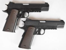 A pair of KWC M45 A1 .177 CO2 air pistols each with chequered grips and 21 shot magazine, serial