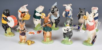 Twelve Beswick novelty pig band figures from the Pig Promenade series, includes three John