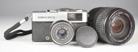 Olympus Trip 35 camera together with a Canon EFS 17-85mm 1:4-5.6 lens to suit SLR