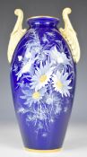 Royal China Works Worcester Grainger and Co twin handled vase decorated with ox eye daisies on a
