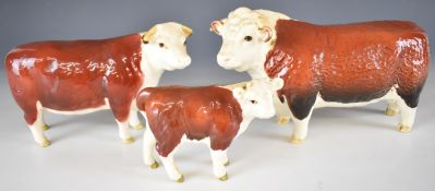 Beswick Hereford bull (first version), cow and calf figures, tallest 13cm