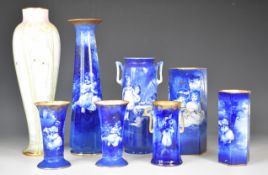 Collection of Royal Doulton 'Blue Children' vases and a tall vase with swan decoration, all for