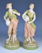 Pair of Royal Dux figures with amphora, height 28cm