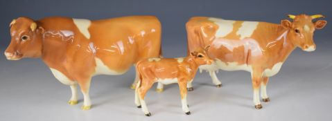 Beswick Guernsey first version bull, cow and calf figures, tallest 11cm