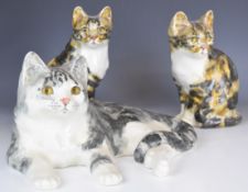 Three large Winstanley cats, two model number 4 and one model number 7, all signed to bases, tallest
