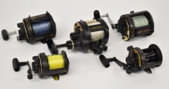 Five Shimano multiplier fishing reels comprising two TLD, two TLD 25 and TLD two speed 20
