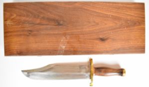 'Bowie' knife marked Randel made Orlando, Fla to 27.5cm blade, with brass cross guard and pommel and
