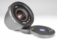 Zeiss Touit Distagon 2.8/12 T* lens with Fuji X type mount, caps and hood