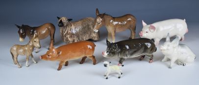 Collection of Beswick farmyard animal figures including sheep, donkey and pigs, tallest 16cm
