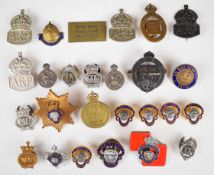 Approximately twenty five military related badges including Royal British Legion, Royal Army
