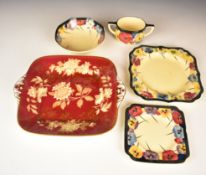 Royal Doulton Art Deco tea ware decorated in the Pansy pattern and a twin handled Wedgwood cake
