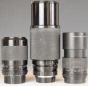 Three SLR camera lenses comprising Minolta mount Soligor 75-250mm 1:4.5, Pentacon 2.8/135 and