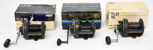 Three Shimano TLD 15 multiplier fishing reels, all boxed with paperwork / accessories