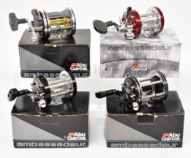 Four Abu Ambassadeur multiplier fishing reels comprising 7000C4LD, 7000i, 7000C Syncro and 7000CL