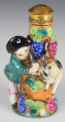 19thC porcelain figural scent / perfume bottle with goat, fruit and vine decoration in relief,