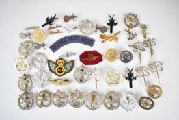 A collection of approximately forty British Airborne, Commando and Army Air Corps badges including
