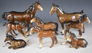 Eight Beswick horses and foals including brown Hackney, first version swish tail, Shire foal etc,