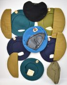Twelve Cold War hats including Russian berets and side hats and an East German beret and side hat,