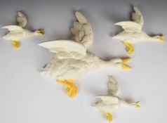 Beswick four flying mallard wall plaques / pockets in unusual yellow and white colourway model