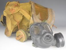 British WW2 baby's gas mask ink stamped VRC 6/39 lot 146/232 together with a Cold War British