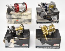 Four Abu Ambassadeur multiplier fishing reels comprising 7200, 7000C4 LD, 7000i and 7000 HSN Big