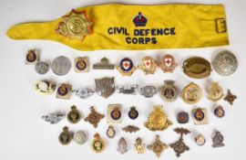 Approximately forty service related badges including Salvation Army, Industrial Civil Defence Corps,