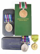 Two Civil Defence Long Service Medals, both boxed, together with a boxed Women's Voluntary Service